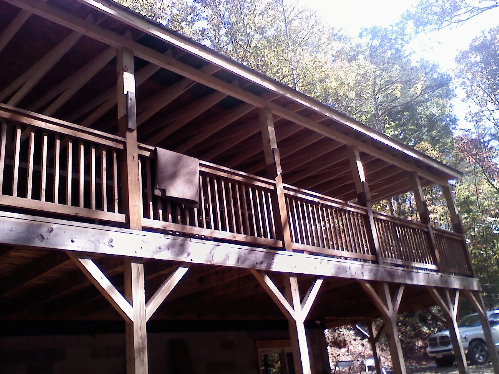 Timber framing under a new elevated porch and deck — Roof Leak Repair in Coburn by Roofing Brothers